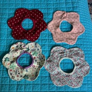 Lot of four colorful cotton baby bibs